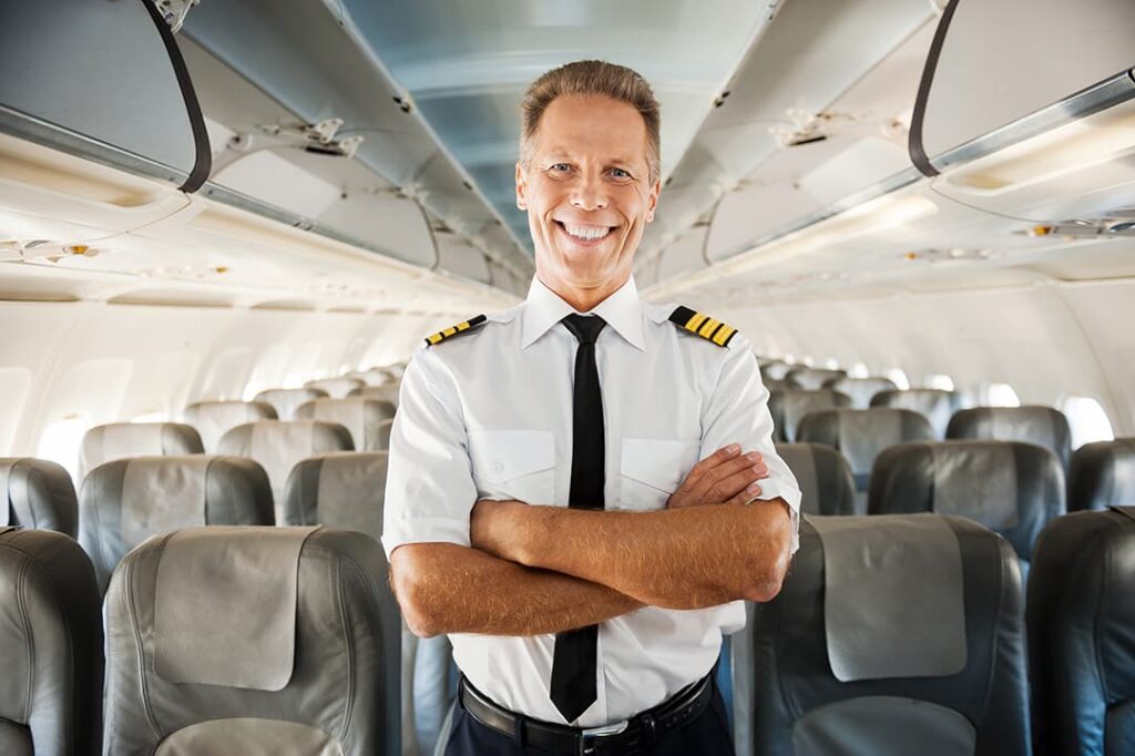 smiling male pilot in cabin